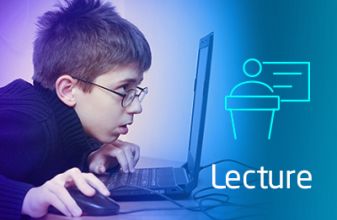 A boy is looks consumed while looking at a computer screen