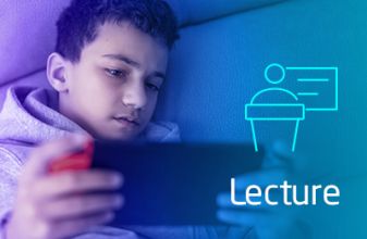 A boy is drained while playing online games on his smartphone