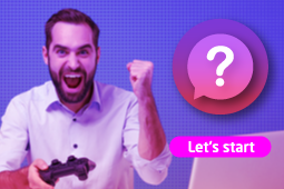 A businessman has a game controller in his hand and his gesturing that he has won the game 