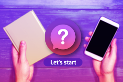 A person is holding a notebook and a phone and trying to choose between 