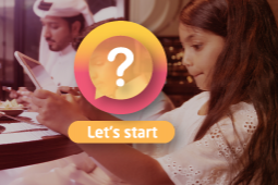 A family busy with their devices while they sit around the dining table