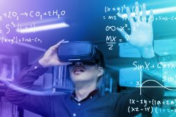 A young boy wearing a virtual reality headset. Around him there is a representation of a virtual reality.
