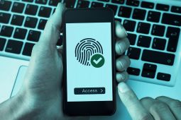 A phone that is protected by a biometric verification that requires fingerprints.