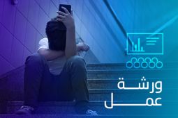 A boy is distraught while looking at the messages he has seen on the screen of his phone