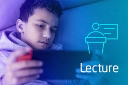 A boy is drained while playing online games on his smartphone