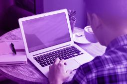 A young man using a laptop.