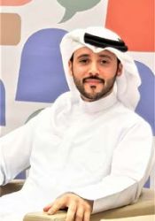 Omar Shaath sitting on a chair.